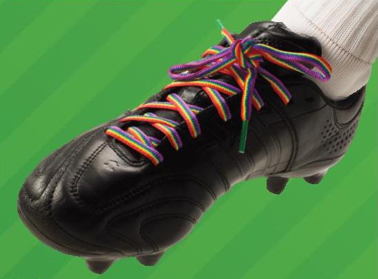 An cleated athletic shoe with rainbow laces
