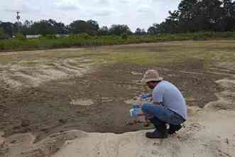 Superfund researcher takes samples of soil, air and water after hurricane
